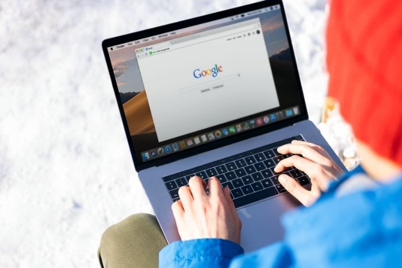 User searching Google on a laptop for local SEO help